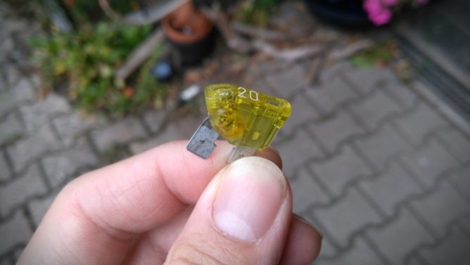A 20A fuse from a car that melted in all places but not where it was supposed to melt